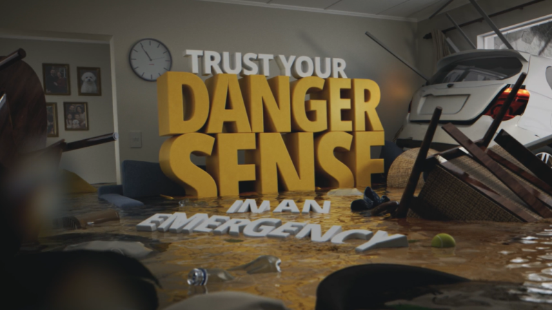 The words "Trust your danger sense in an emergency" float inside a flooded living room